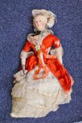 A 19th century composition shoulder headed Marie Antoinette fashion doll with glass eyes and