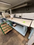 TABLE WITH PLASTIC TOP, MOUNTED ON CASTERS, 84