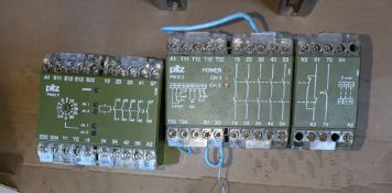 Qty (2) Pilz Safety Relays - 24 volt - DC Control - one unit 4 channel contacts, one unit 4 channel,
