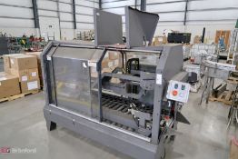Pearson packing system automatic tapper