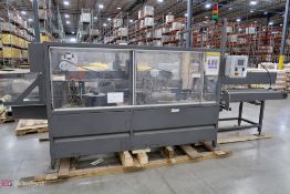 Pearson packing system automatic tapper