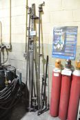 Lot-Various Long Bar Clamps Against the Wall