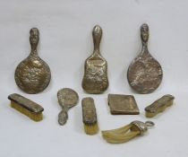 Extensive matched silver-mounted dressing table service, all embossed with cherub's heads after