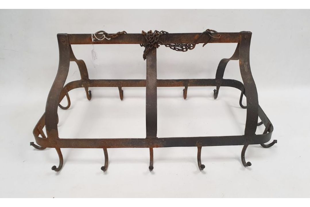 Antique wrought iron pot rack, of arched rectangular form, suspended from chains, with sixteen hooks