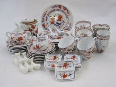 20th century Chinese porcelain dinner and tea service, iron-red and blue flowering branch decoration