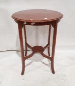 Circular occasional table on square section supports