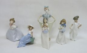 Six Nao figures, printed brown marks comprising two figures of girls cuddling dolls, a girl
