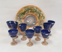 Large Jersey pottery charger with hand painted pear and leaf decoration and a set of studio