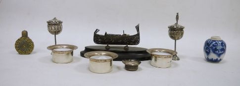 Possibly Balinese silver-coloured metal vase with oblate body and having tall screw-in spire finial,