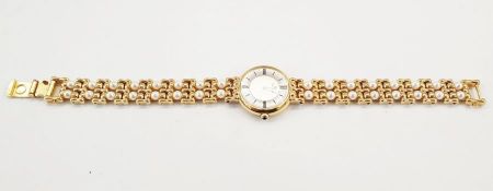 Lady’s Mikimoto cultured pearl set rolled gold wristwatch, black onyx button, twin strapCondition