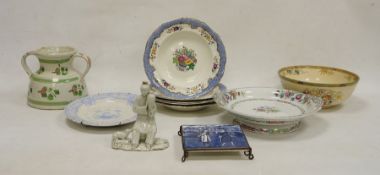 Chinese blanc de chine figure, modelled seated holding an urn beside a recumbent hound, on