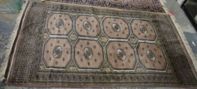 Eastern mushroom ground rug with two rows of four elephant foot guls and geometric borders 222 x 127