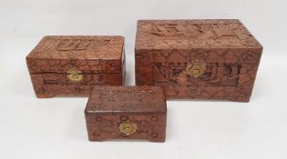 Chinese nesting set of three miniature camphorwood lined chests with carved decoration