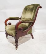 Late Victorian armchair with overscrolled arms, on turned front legs to brass castors, green