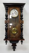 Modern Vienna regulator-type clock with Roman numerals to the dial