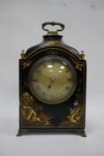 20th century Mappin & Webb mantel clock in chionoiserie black ground case, with brass carry