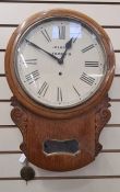 Oak drop-dial wall clock, the circular dial inscribed Marsh, Norwich, glass aperture below having