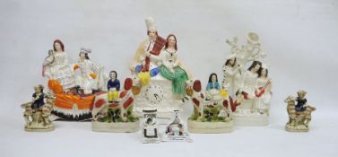 Group of Staffordshire and Staffordshire-style pottery figures, circa 1860 and later, including a