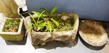 Composite stone planter in the form of a log, a composite stone model of a woman and child, two