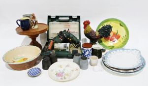 Bosch drill in case, a metal cockerel doorstop, a rotating wooden stand together with chinaware (1