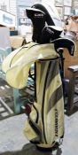 Part set of Adams women's golf clubs with golf bag and a floor standing light