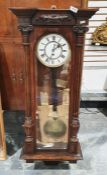 Vienna-type regulator wall clock with Roman numerals to the dial, oak cased with column pilasters