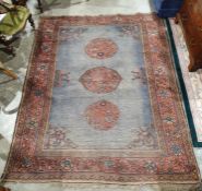Kazak-type rug with plain blue field with three central red ground field with three central red