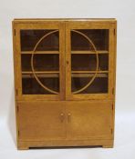 20th century Art Deco cabinet by Denby & Spinks Ltd, in burr maple, with glazed doors enclosing