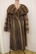 Vintage mink coat with a deep shawl collar, bell bracelet sleeves, patterned liningCondition