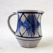 Alan Caiger-Smith blue and white pottery jug with zigzag decoration, monogram to base (12 cm tall)