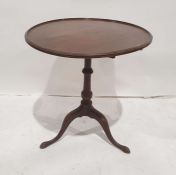 Georgian mahogany tripod table, the circular dished top on turned pedestal to tripod base