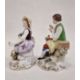 Pair continental porcelain figures of lady seated with flowers and basket of flowers at her feet, - Image 2 of 3