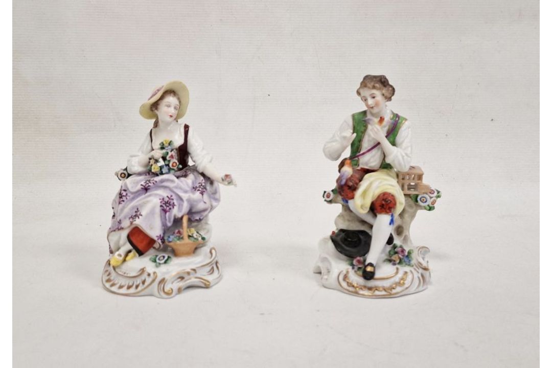 Pair continental porcelain figures of lady seated with flowers and basket of flowers at her feet, - Image 1 of 3
