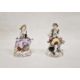 Pair continental porcelain figures of lady seated with flowers and basket of flowers at her feet, - Image 1 of 3