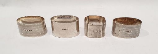 Four various silver napkin rings (4)