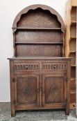20th century oak dresser, the arched top above two shelves, on base of two drawers and two