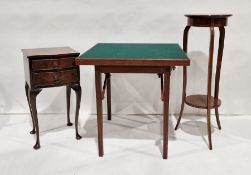 20th century walnut serpentine-fronted two-drawer bedside chest on cabriole legs, a two-tier