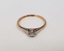 18ct gold small solitaire diamond ring, the claw set stone with platinum shoulders, in small vintage