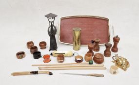 Assortment of wooden napkin rings, two salt grinders and two pepper grinders, gold-coloured tray and