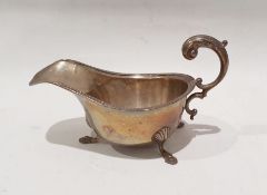 George V silver gravy boat raised on three feet, Birmingham 1930 by S Blanckensee & Sons Ltd
