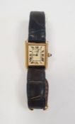 Lady's silver gilt Must de Cartier tank wristwatch with rectangular dial, roman numerals, cabochon