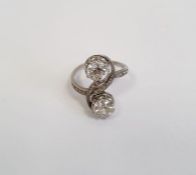 Diamond two-stone crossover ring, each diamond approx. 0.7ct and on scroll crossover branch inset