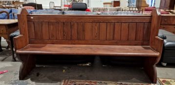 20th century pine pew, the shaped end supports with trefoil design in roundel, 189cm wide
