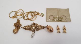 9ct gold 'chicken in egg' pendant, a 9ct gold small heart-shaped pendant, two gilt metal chain