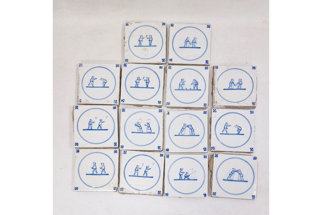 14 blue and white delft tiles, each of two figures, within circle to include wrestling and - Image 1 of 5