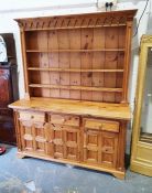 20th century pine dresser, with moulded cornice, open shelves, three drawers, three cupboard