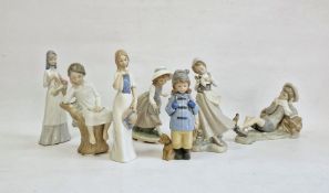 Lladro figure of girl with doves, a Lladro boy reclining with bird, another Lladro figure of boy