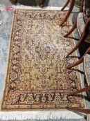 Modern Eastern-style yellow ground rug with central medallion, 150cm x 90cm