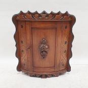 Mahogany wall-hanging bowfront corner cabinet with moulded decoration, 54cm x 34cm x 34cm