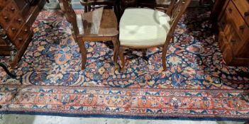 Eastern rug, the blue ground with foliate decoration, pink ground border, 377cm x 163cmCondition